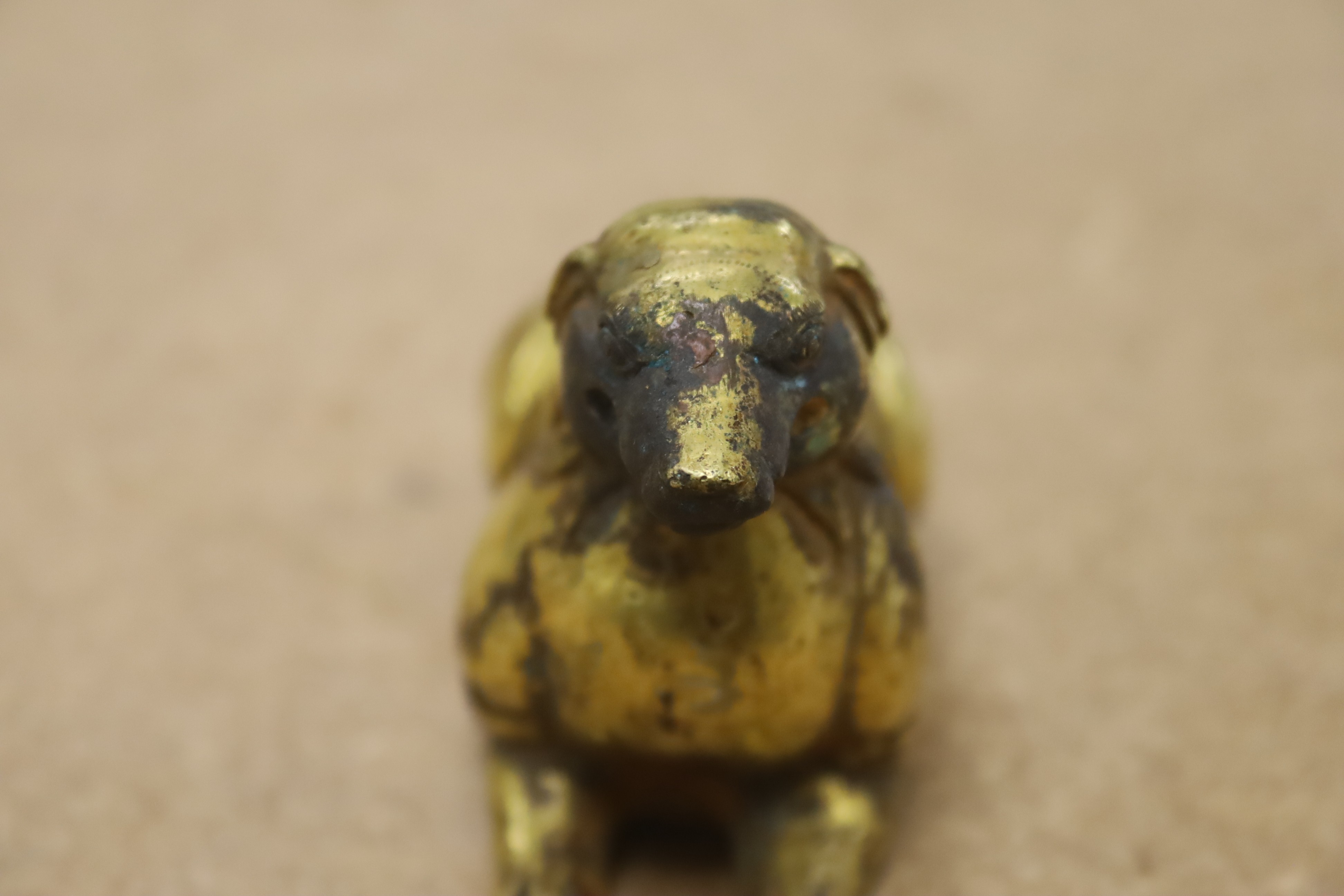 A Chinese gilt bronze dog, 7cm wide